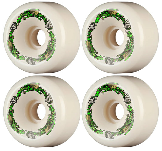 Four white skateboard wheels with green and black designs on a white background
