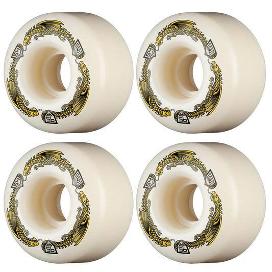 Four white wheels with gold and black designs on a white background