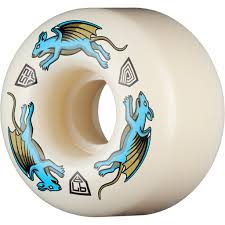 An off-white skateboard wheel featuring a blue and gold winged gargoyle graphic, with small black geometric icons.
