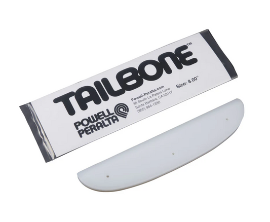 White skateboard deck with Tailbone and Powell Peralta branding on a white background