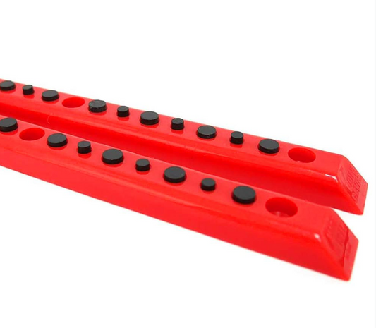 Red plastic rails with black knobs on a white background