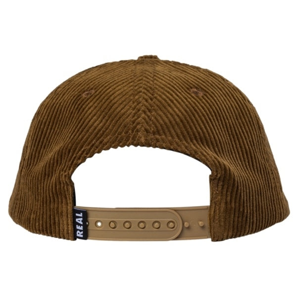 Rear view of a brown corduroy baseball cap with a tan adjustable strap and a small black brand tag reading 'REAL'.