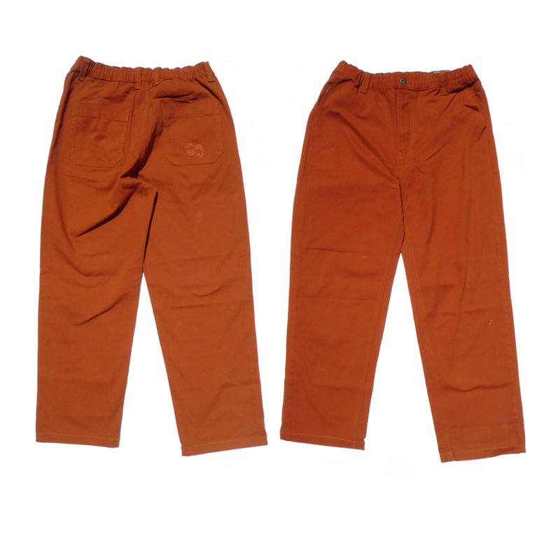 Pair of orange pants on a white background