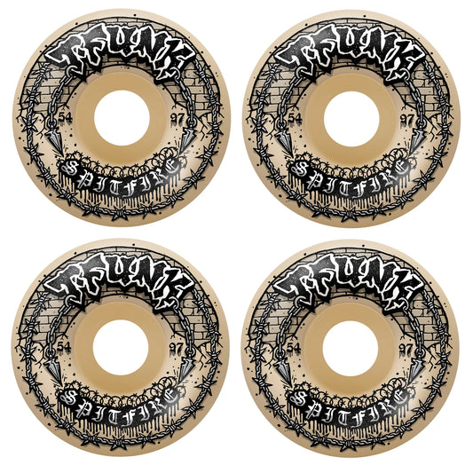Four Spitfire skateboard wheels with intricate black designs on a beige background