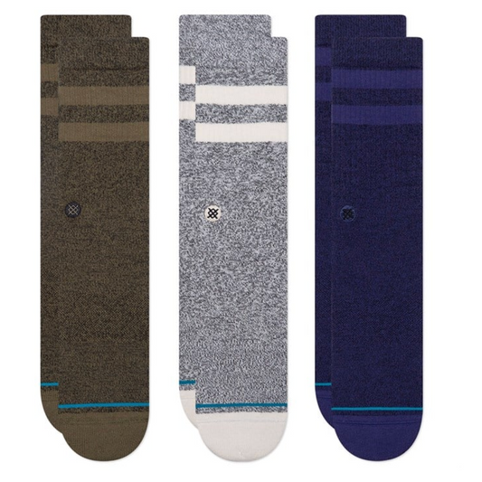 Three pairs of socks in brown, gray, and blue on a white background