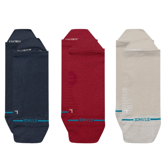 Three pairs of socks in navy, red, and beige on a white background