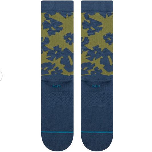 Pair of blue socks with green floral pattern on a white background