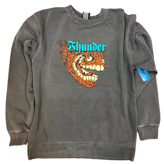 Gray sweatshirt with a graphic design and 'Thunder' text on a red and beige patterned background