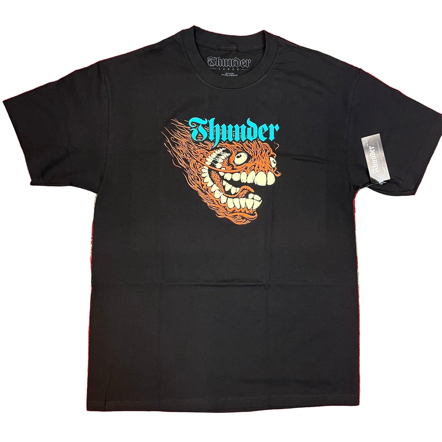 Black t-shirt with a colorful graphic design on a red and white background