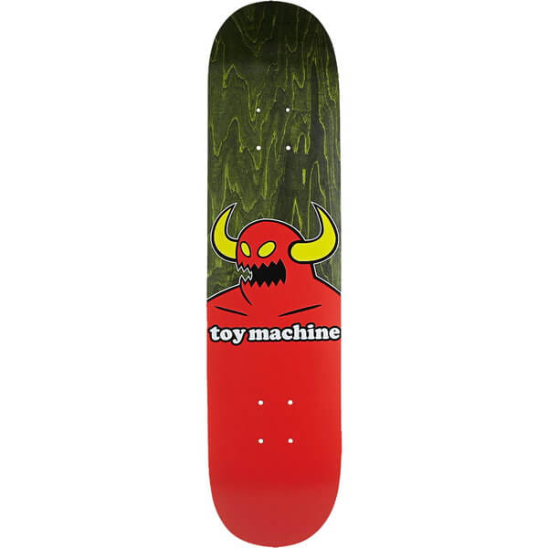 A skateboard deck shown vertically against a plain white background. The deck features a red lower half with the words 'toy machine' in white, and a green marbled upper half with a red cartoon devil graphic that has yellow horns.