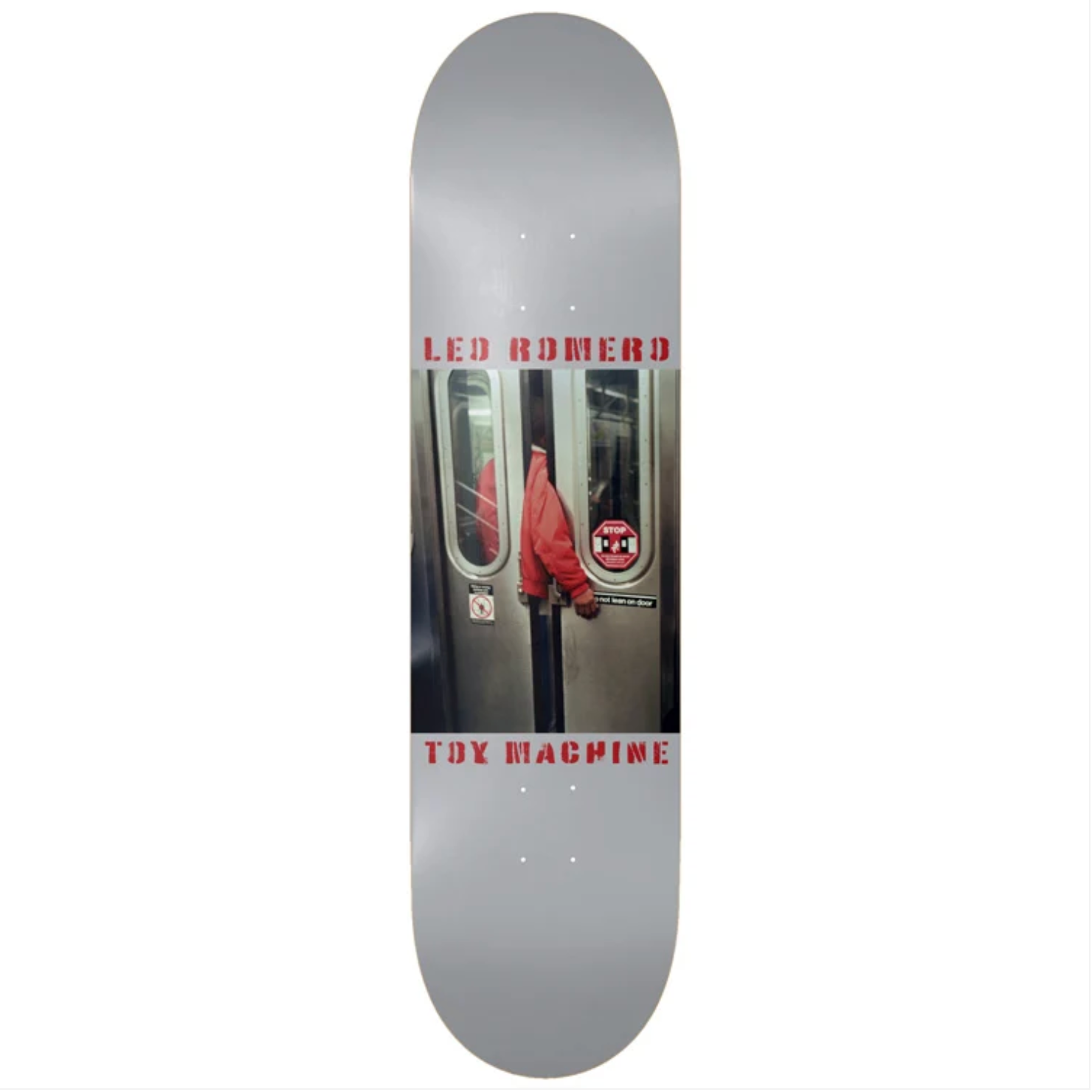 A skateboard deck featuring a graphic print of a subway train door with a red jacket hanging down, and the text 'LED ROMERO' and 'TRY MACHINE' in red, shown on a plain white background.