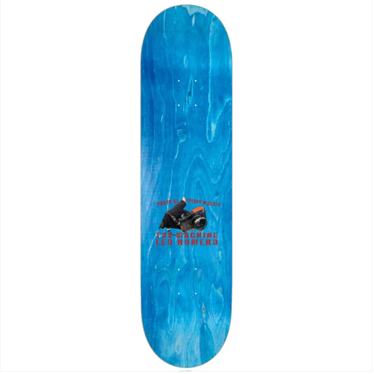 A skateboard deck with a blue watercolor woodgrain pattern, featuring a central graphic of a skateboarder and the text 'SKATE WITH TOMMY JONES' and 'LE ROUMI' in red.