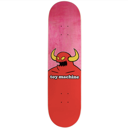 A skateboard deck shown from the top side, featuring a pink-to-red gradient background with a cartoon devil graphic and the text 'toy machine' in white with a black outline.