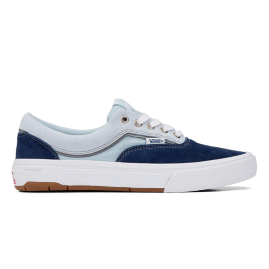 Navy and light blue sneaker with a white sole on a white background