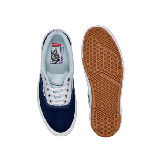 Navy blue sneaker with white laces and a brown sole on a white background