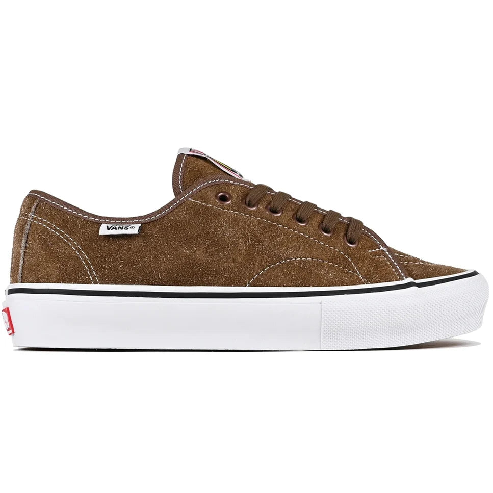A brown suede Vans platform sneaker with a thick white sole, black stripe, and white Vans logo on the side, shown against a plain white background.