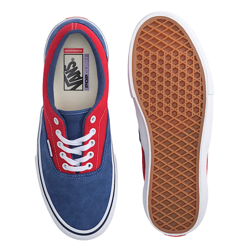 Blue and red Vans sneakers with a focus on the sole and brand logo.