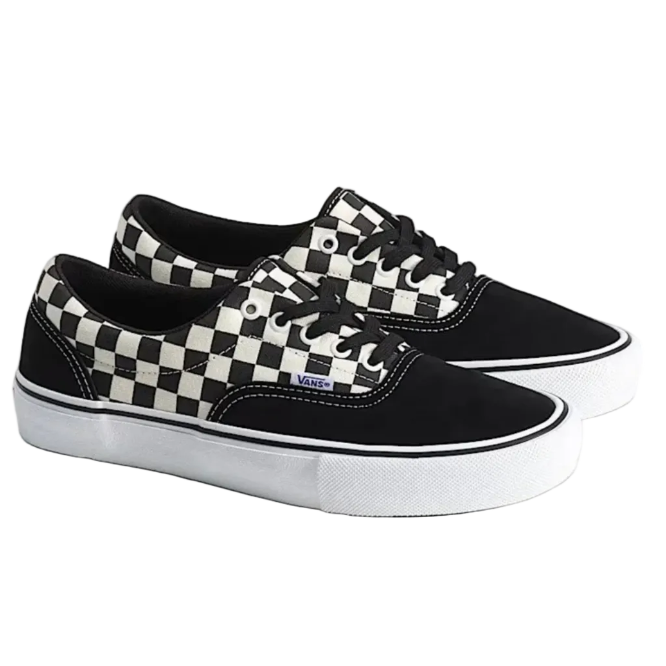 A pair of Vans low-top sneakers in black and white checkerboard canvas and black suede, featuring white rubber soles.