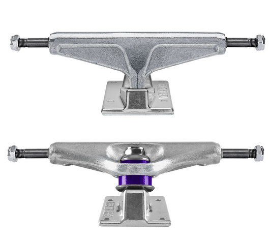 Two metallic skateboard trucks on a white background