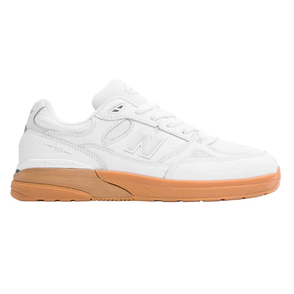 White sneaker with brown sole on a white background