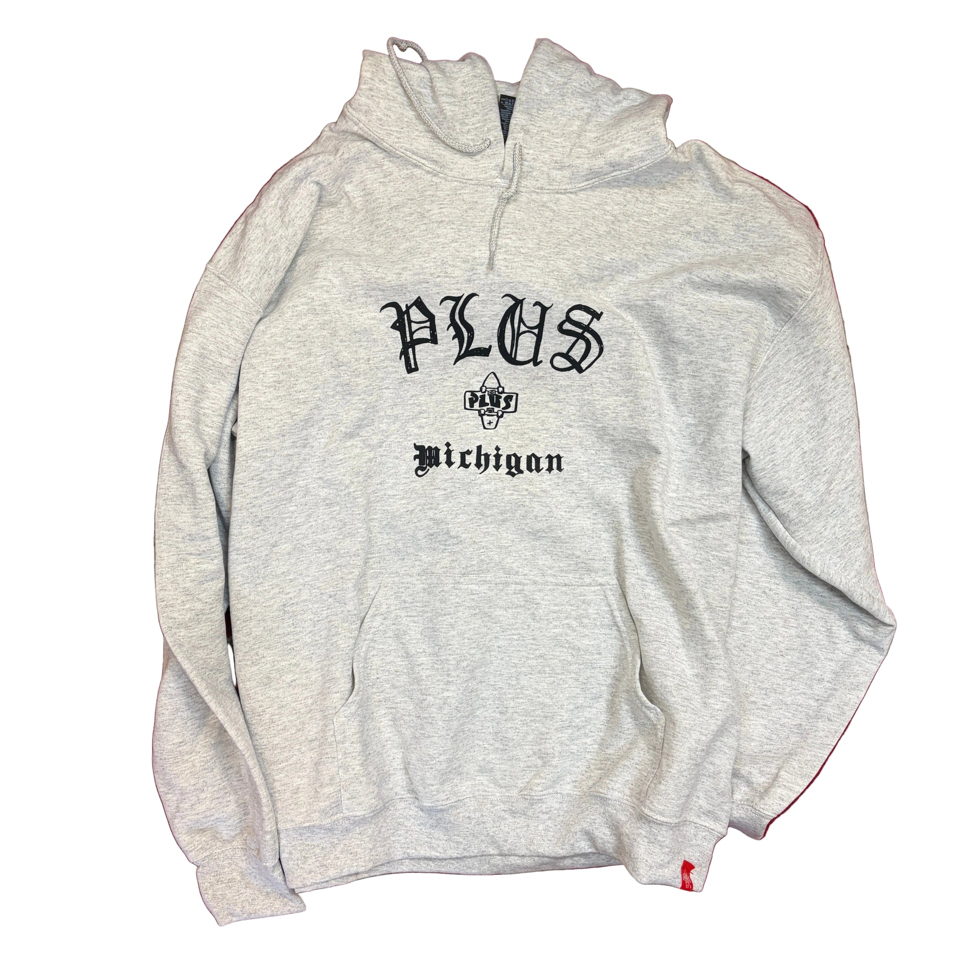 Gray hoodie with 'PLUS Michigan' text on a red and beige patterned surface